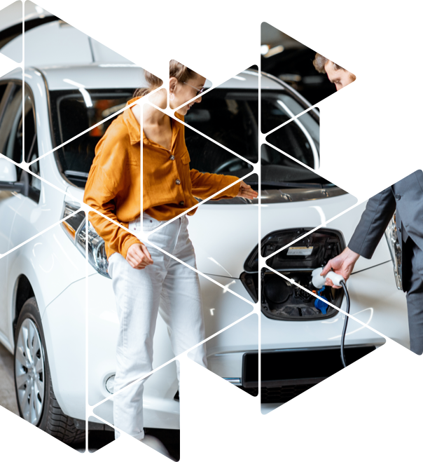 woman and man charging electric car